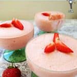 3 glasses of strawberry mousse decorated with strawberries