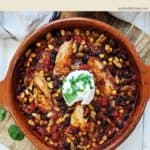 A chicken casserole on a wooden board