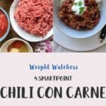 A white bowl filled with chili con carne & rice topped with yogurt and green herbs