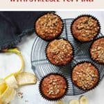 Banana Muffins on a wire rack with a peeled banana along side