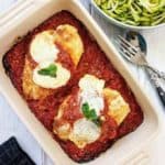 A dish of Chicken Parmesan on a white table | weight watchers