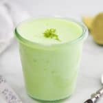 A pot of green Weight Watchers lime fluff on a white table.