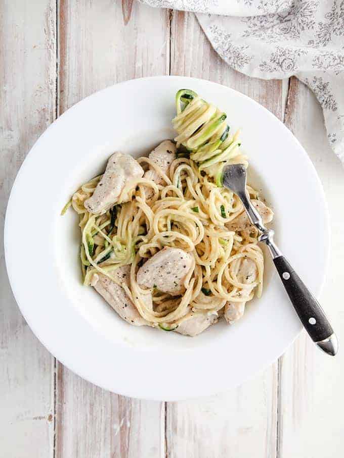 A bowl of chicken Alfredo and zucchini noodles