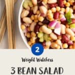 WW Three Bean Salad in a white bowl with salad servers
