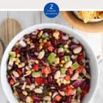 A white bowl of Mexican bean salad