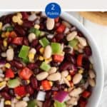 A white bowl of Mexican bean salad