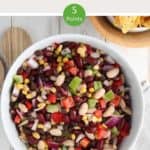 A white bowl of Mexican bean salad