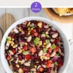 A white bowl of Mexican bean salad