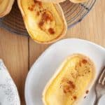 A custard tart on a white plate