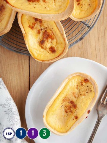 Custard tarts on a wooden table