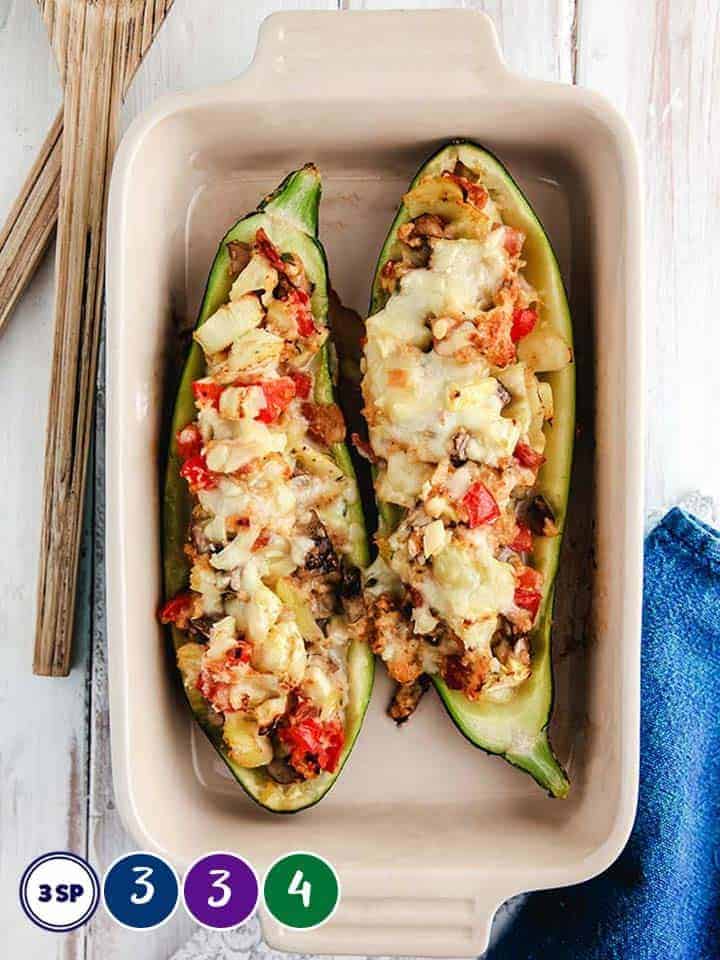 A dish full of stuffed zucchini