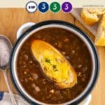 A white bowl of French Onion Soup