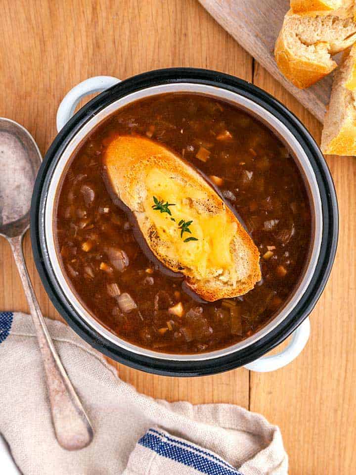A bowl of WW French Onion Soup on a wooden table