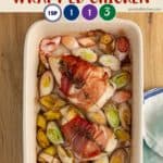 A dish layered with leeks and ham wrapped chicken.