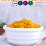 A white dish of mashed butternut squash