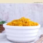 A white dish of mashed butternut squash