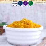 A white dish full of roasted butternut squash mash