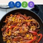 A skillet full of chicken fajitas