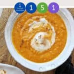 Carrot and lentil soup in a bowl on a table