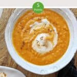 A bowl of soup on a wooden table