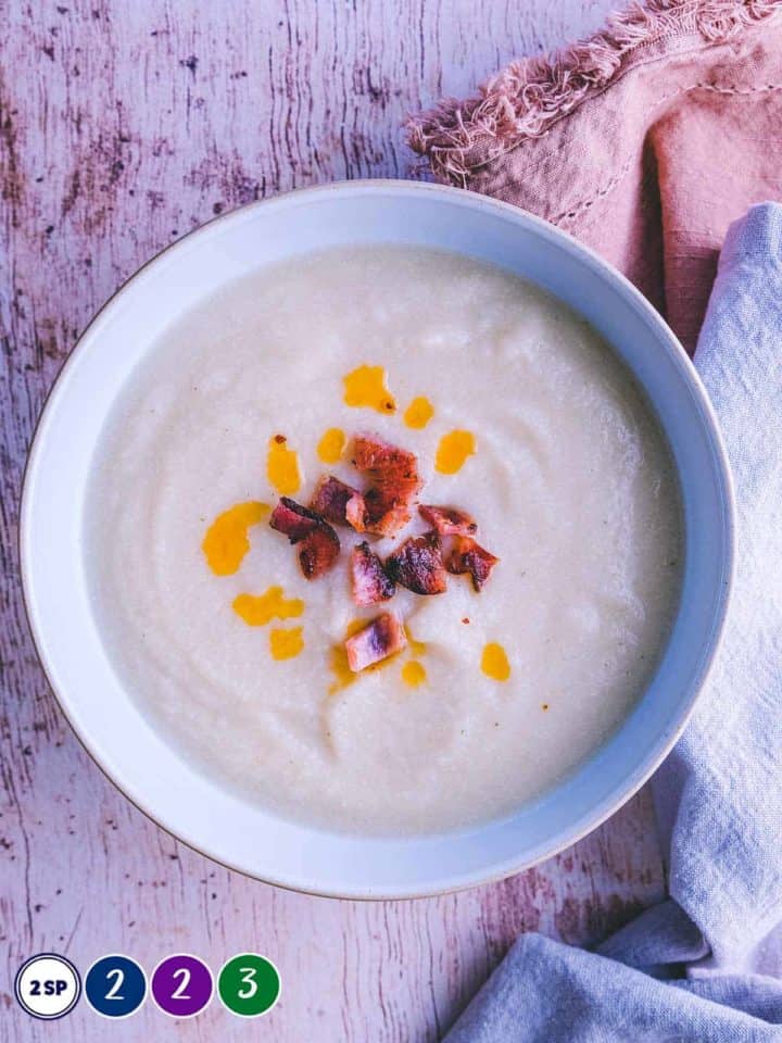 A white bowl full of white bean soup