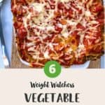 A dish of vegetable lasagna on a wooden board