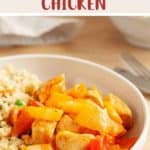 A white bowl of sweet & sour chicken with cauliflower rice on a wooden table