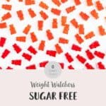 Red, green and orange gummy bears on a white background