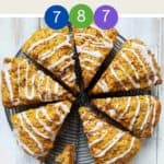 Eight pumpkin spiced scones on a circular wire cooler.