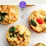 A picture of egg muffins on a white table with a text overlay stating WW Breakfast Egg muffin 1 point.