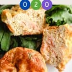 2 breakfast muffins on a bed of lettuce.