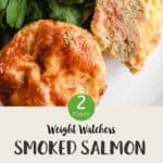 2 breakfast muffins on a white plate with lettuce & text overlay stating Weight Watchers Smoked Salmon Breakfast muffins.
