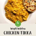 A white ceramic dish full of curry and a naan bread with text overlay stating Weight Watchers chicken tikka masala.