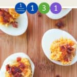 5 cheese and bacon stuffed eggs on a wooden board.