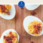 5 cheese and bacon stuffed eggs on a wooden board.