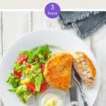 A white plate with a fishcake and some salad on a white wooden table with text overlay 'Weight Watchers Tuna Fish Cakes'.