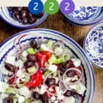 Greek Salad in a blue and white bowl with title text overlay and smartpoint values.