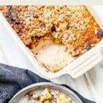 A baking dish of baked oatmeal on a white table.